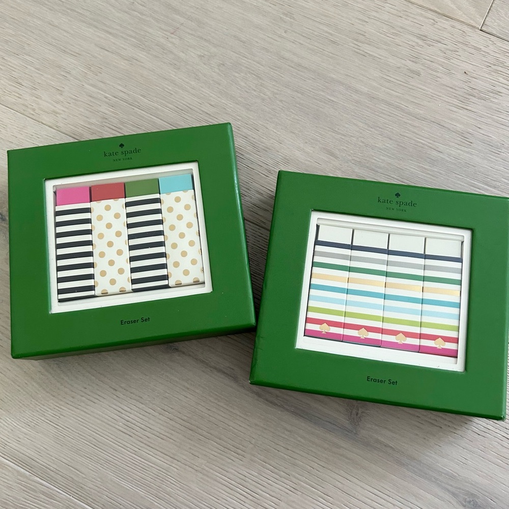Two boxes of Kate Spade erasers candy stripe and cream colored